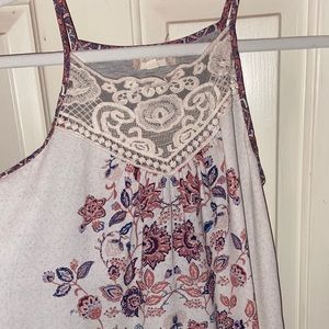 A tank top with a sheer front and cotton back.